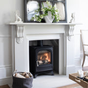 Arada Multi-fuel Wood Burning Stove with flames in chimney breast
