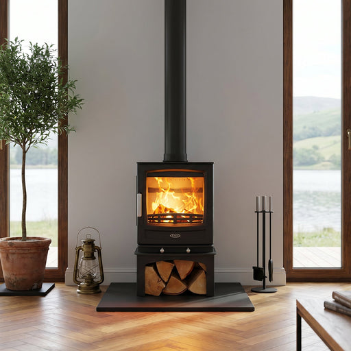Modern living room with Mazona A05 wood Burning stove, large windows, and scenic view.