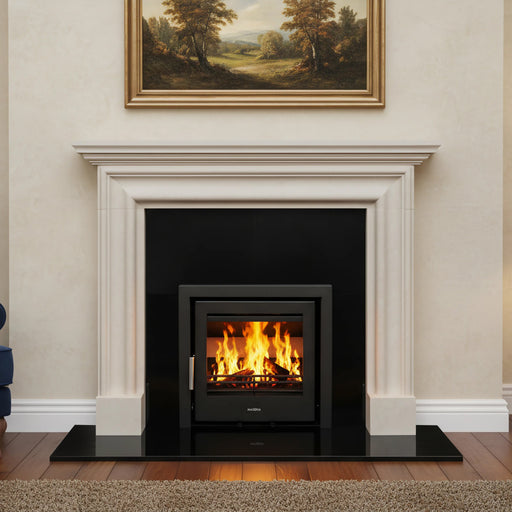 Living room with a fireplace, blue sofa, and painting on the wall.