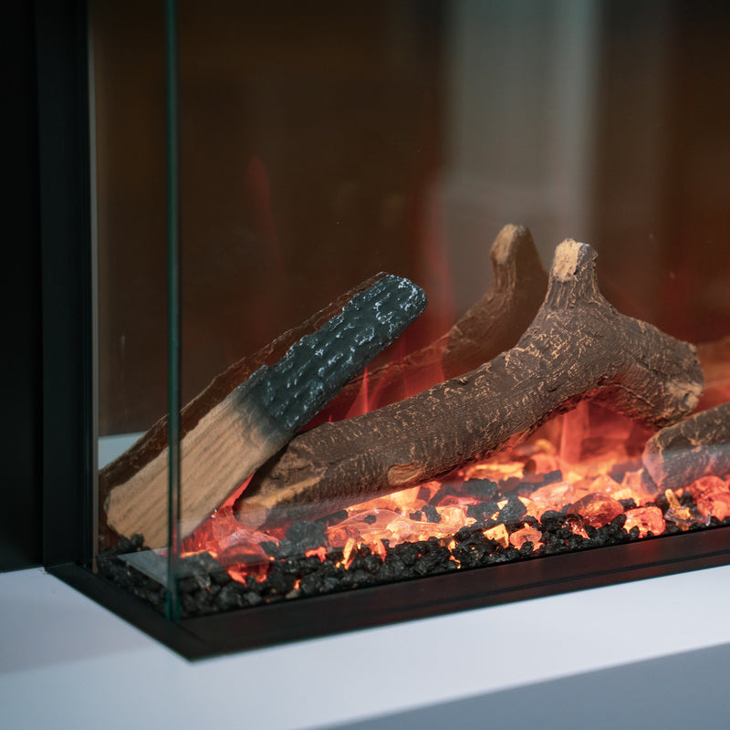 Electric fireplace with glowing logs and flames inside a glass enclosure.