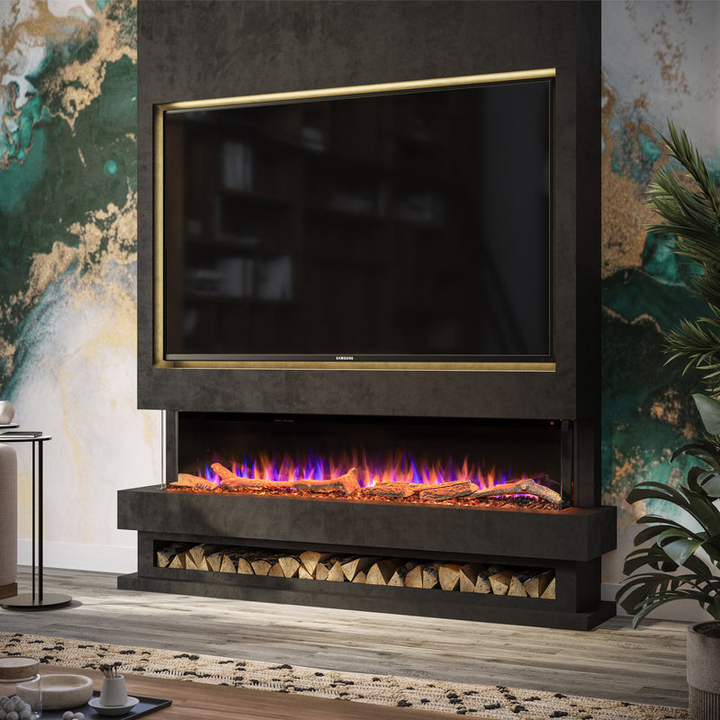 A modern wall-mounted electric fireplace with a black textured surround, a built-in TV screen, and glowing blue, purple, and orange flames above faux logs, installed in a styled living room with a side table, sofa, and potted plant.