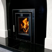 Mazona Clovelly 400 5kW 3 Sided Glass Trim Stove, Multifuel, Woodburning, Cassette, Inset, Eco Design Approved, Defra Approved on white background in fire place with flames and log burners
