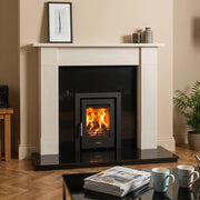 Living room with marble fireplace and mazona cassette stove 