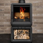 Grey wood stove on a brick wall background 