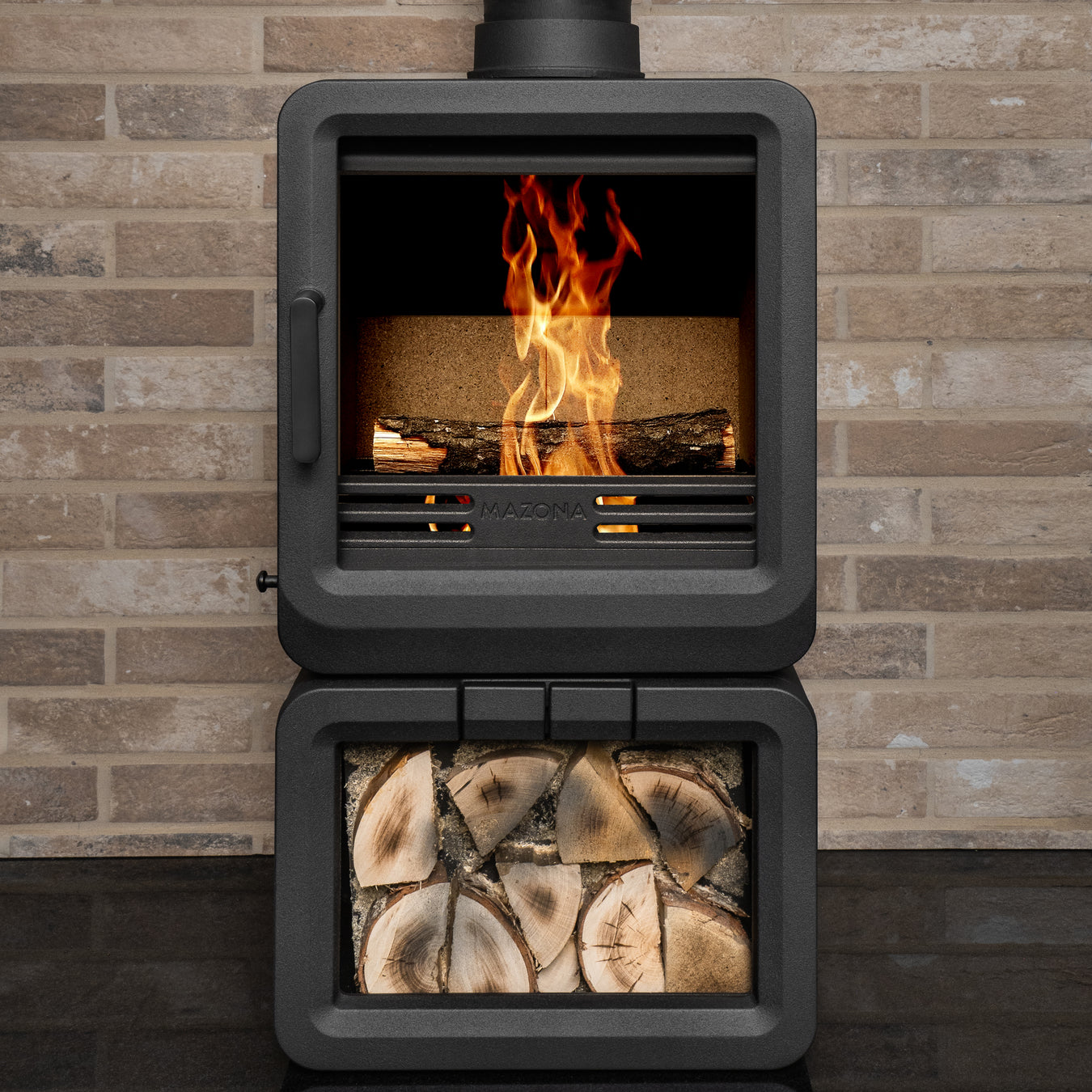 Grey wood stove on a brick wall background 