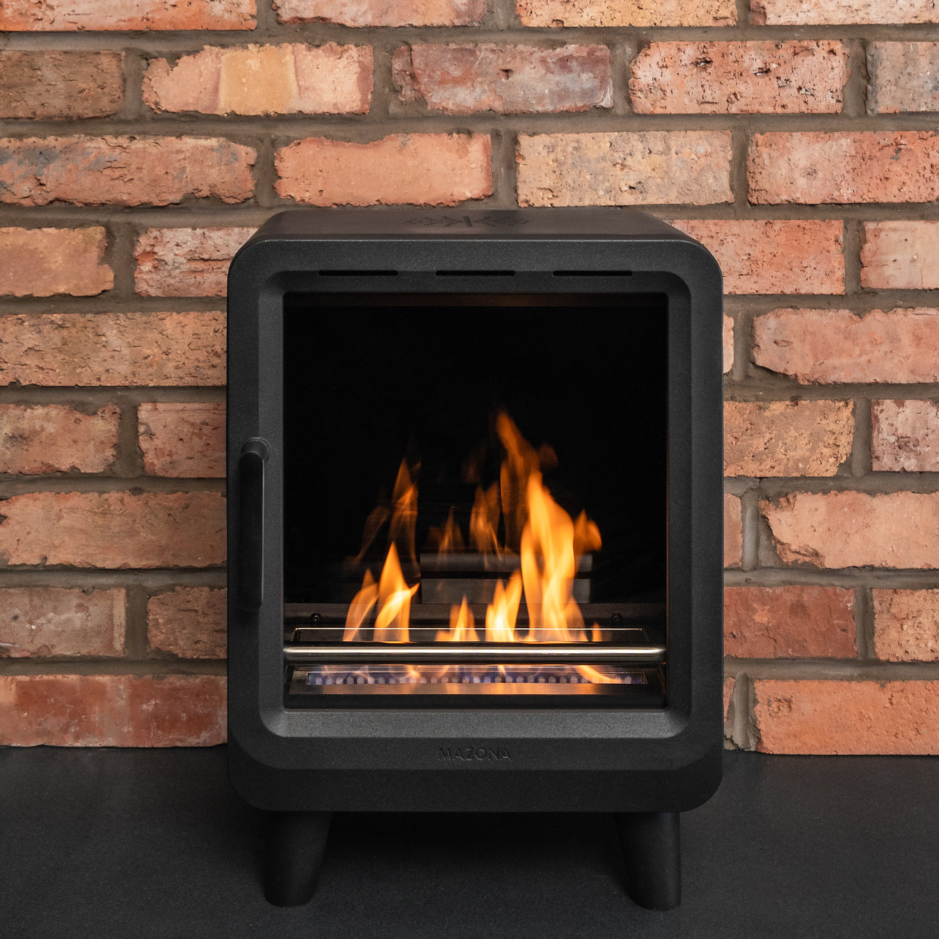 Mazona Heatwave Bioethanol stove on red brick wall 