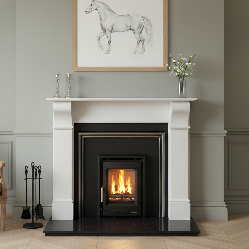 Living room with a fireplace, chair, and wall art.