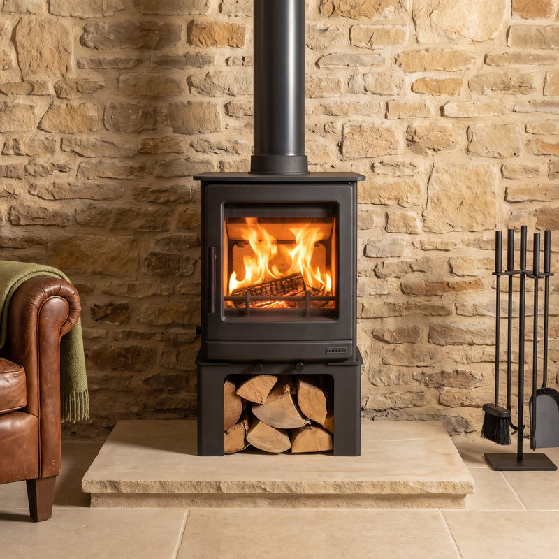 stove with logstore in rustic living room 