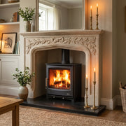 Cozy living room with a fireplace, candles, and decorative items.