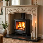 Cozy living room with a fireplace, candles, and decorative items.