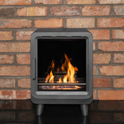 Mazona heatwave stove with flame and red brick wall 
