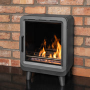 Mazona grey heatwave stove with flame and red brick background 