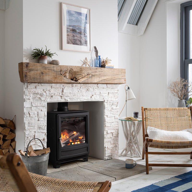 Arada Ecoburn 7 with a brick fireplace in a living room