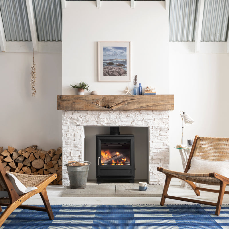 Arada Ecoburn 7 in a brick fireplace in a white fireplace in a living room 