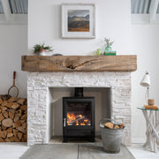 Arada Ecoburn Plus 5 kW in a white fireplace in a living room